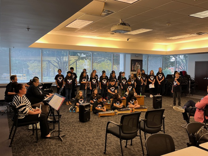 Students from the Westlawn Elementary School Chorus and Instrumental Ensemble performing at the Gatehouse Cafe.