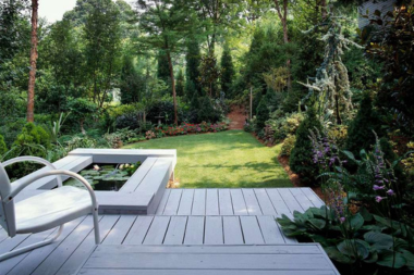 combining hardscaping and decking for a unique outdoor living space built in water feature for deck custom built michigan