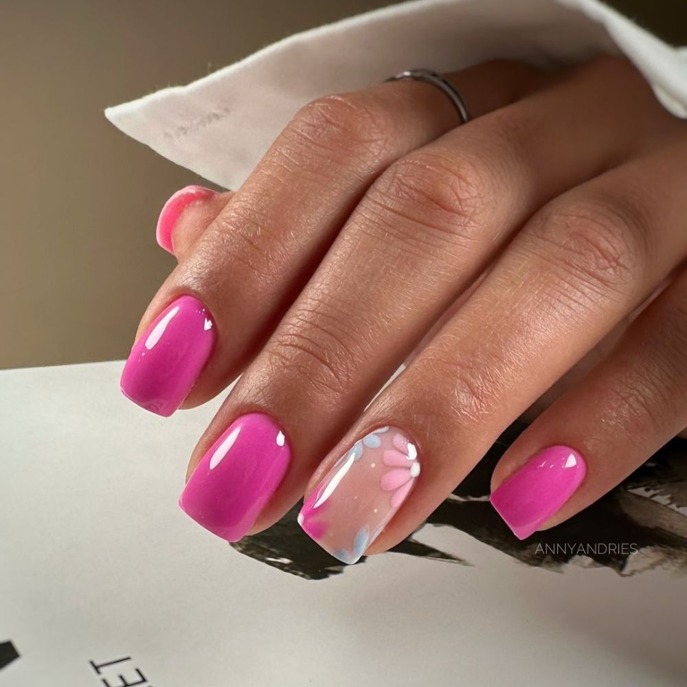 Close up of flowered short nail design with pink nails