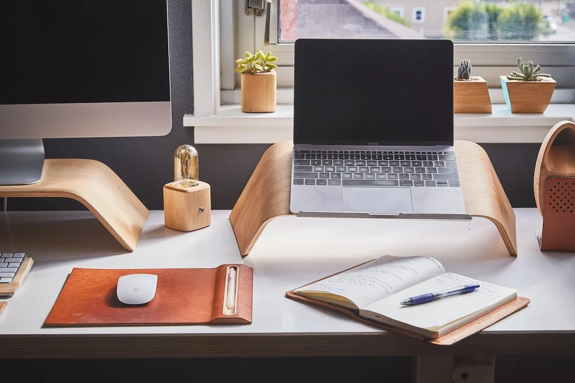 home office setup with laptop and notebook