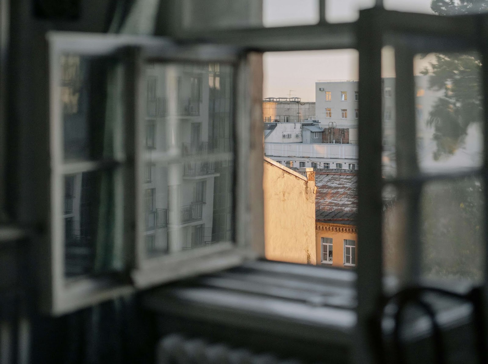 A window opens up to a city view.