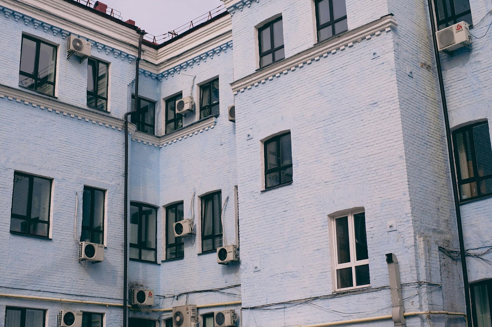 A multi-story apartment building with HVAC blower motor replacements needed on each HVAC unit