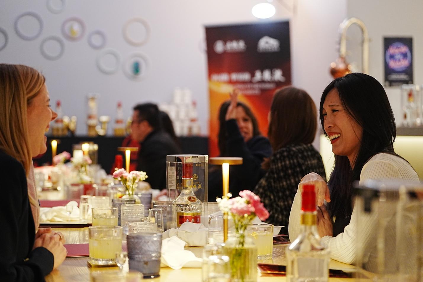 A group of people sitting at a table

AI-generated content may be incorrect.