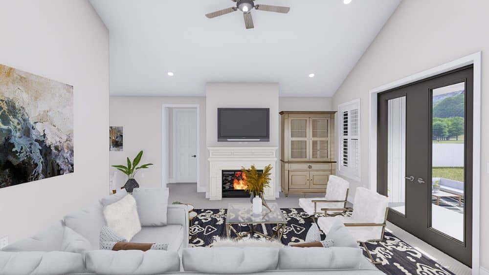 The living room offers an L-shaped sectional, white cushioned chairs, and a marble fireplace.