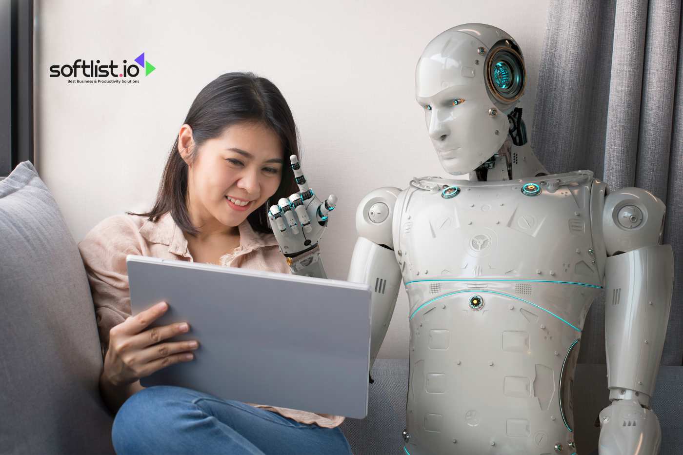 Woman sitting with a robot, using Softlist.io software on a tablet