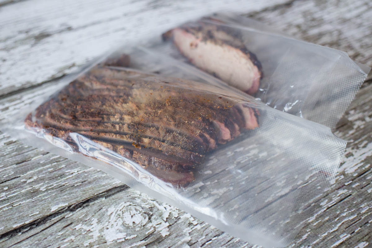 Leftover BBQ beef brisket loaded into vacuum sealer bags
