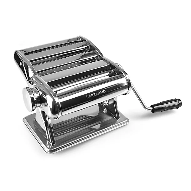A shiny stainless steel Lakeland pasta machine with a hand crank on a white background.
