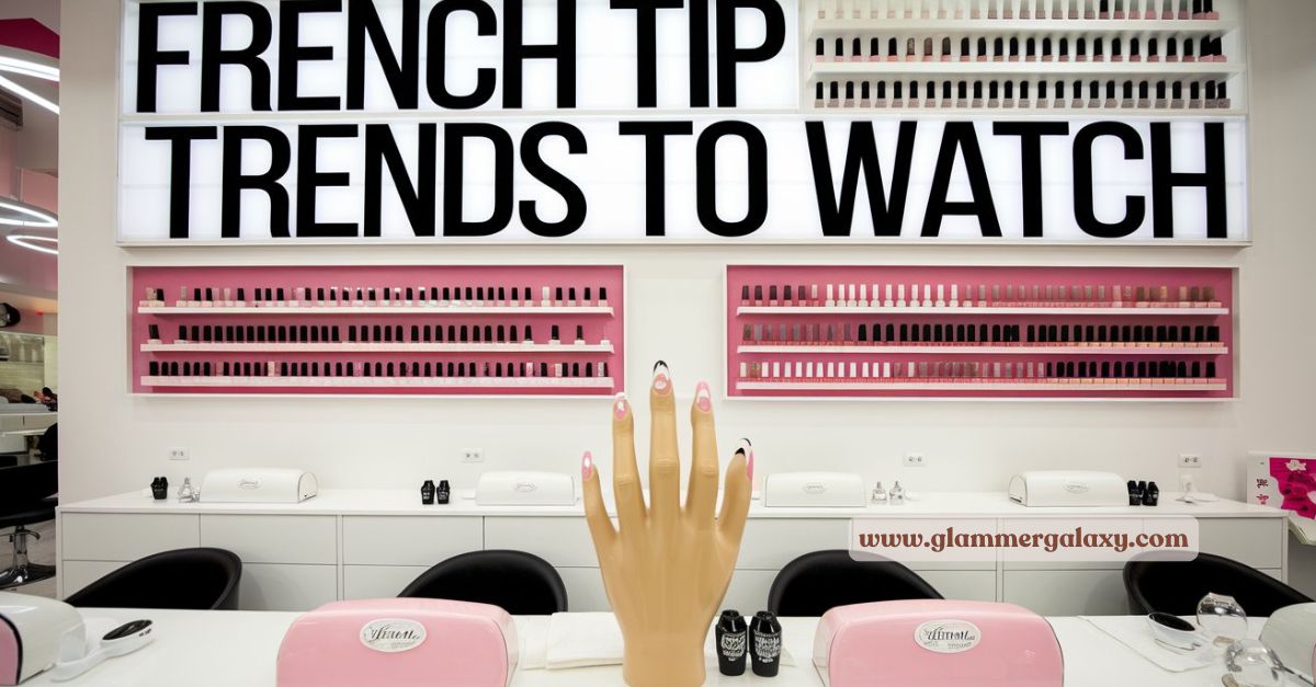 Nail salon interior with pink French tip polish display and a hand model showcasing painted nails.