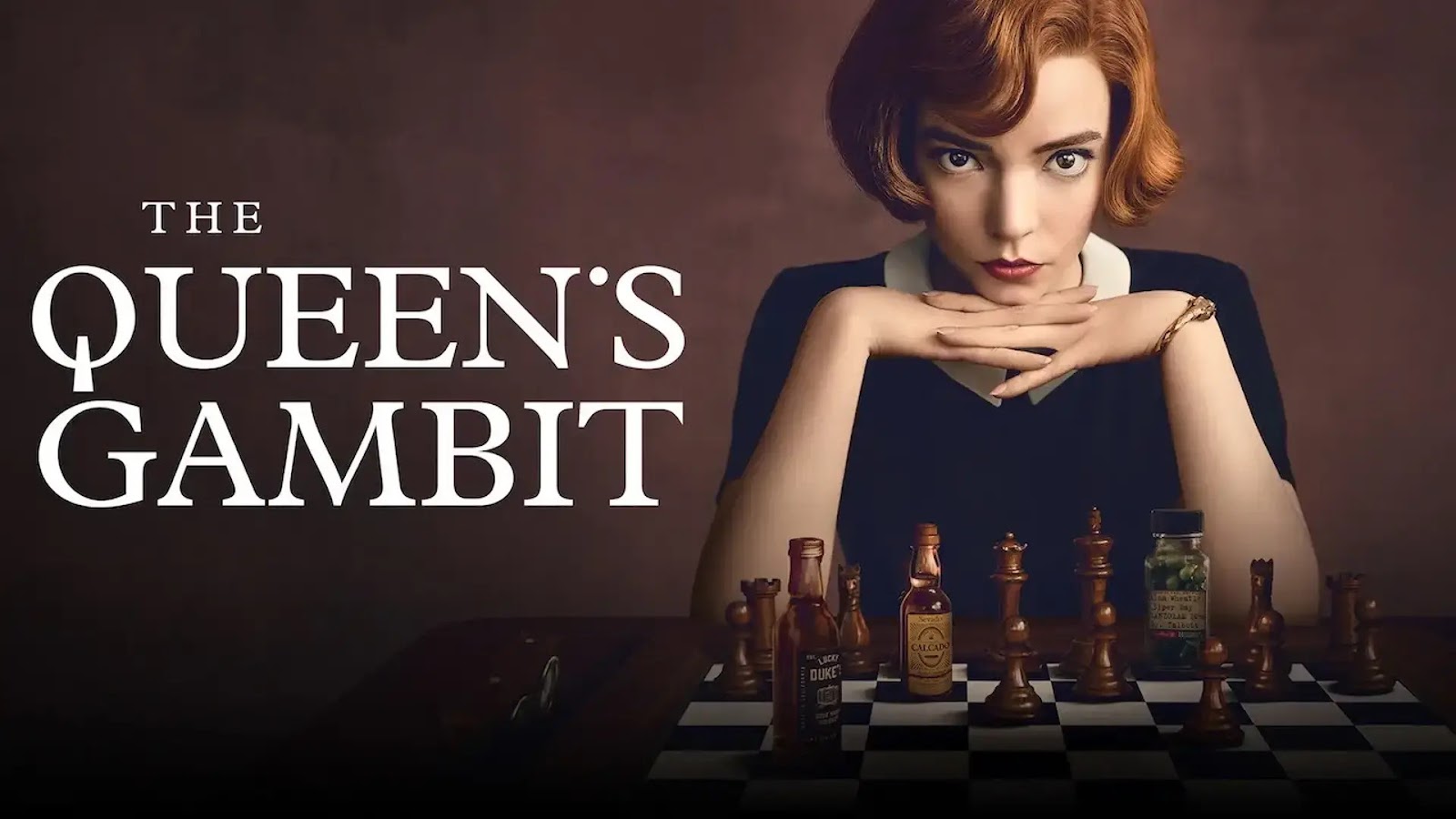 a women sitting with a chess board and staring into the camera as the first person
