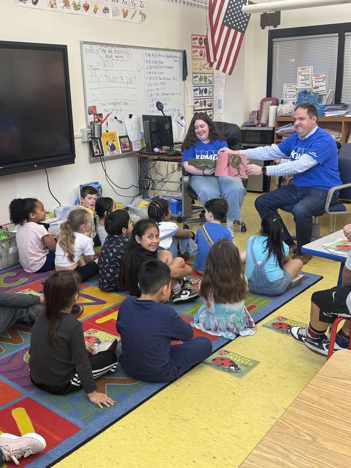 KPMG volunteers reading to Hart students