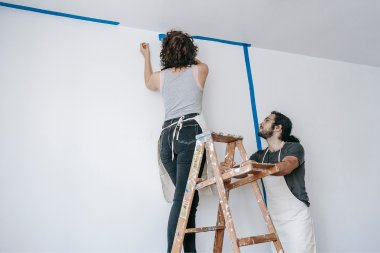 is a full house remodel worth it how to decide if its right for your family couple painting walls in diy remodeling project custom built michigan