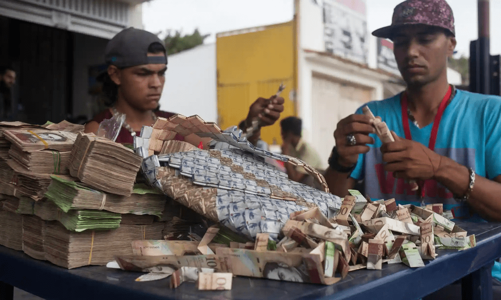 Lebanese men with stacks of currencies on a table.