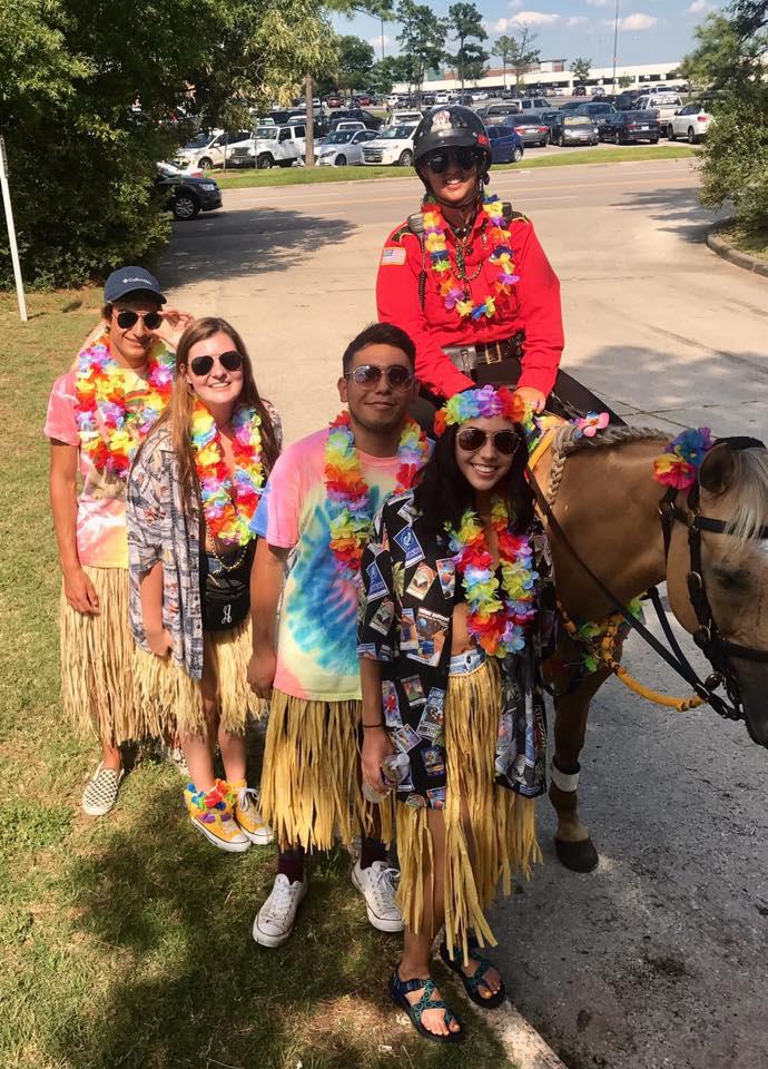 A group of people posing for a photo

AI-generated content may be incorrect.