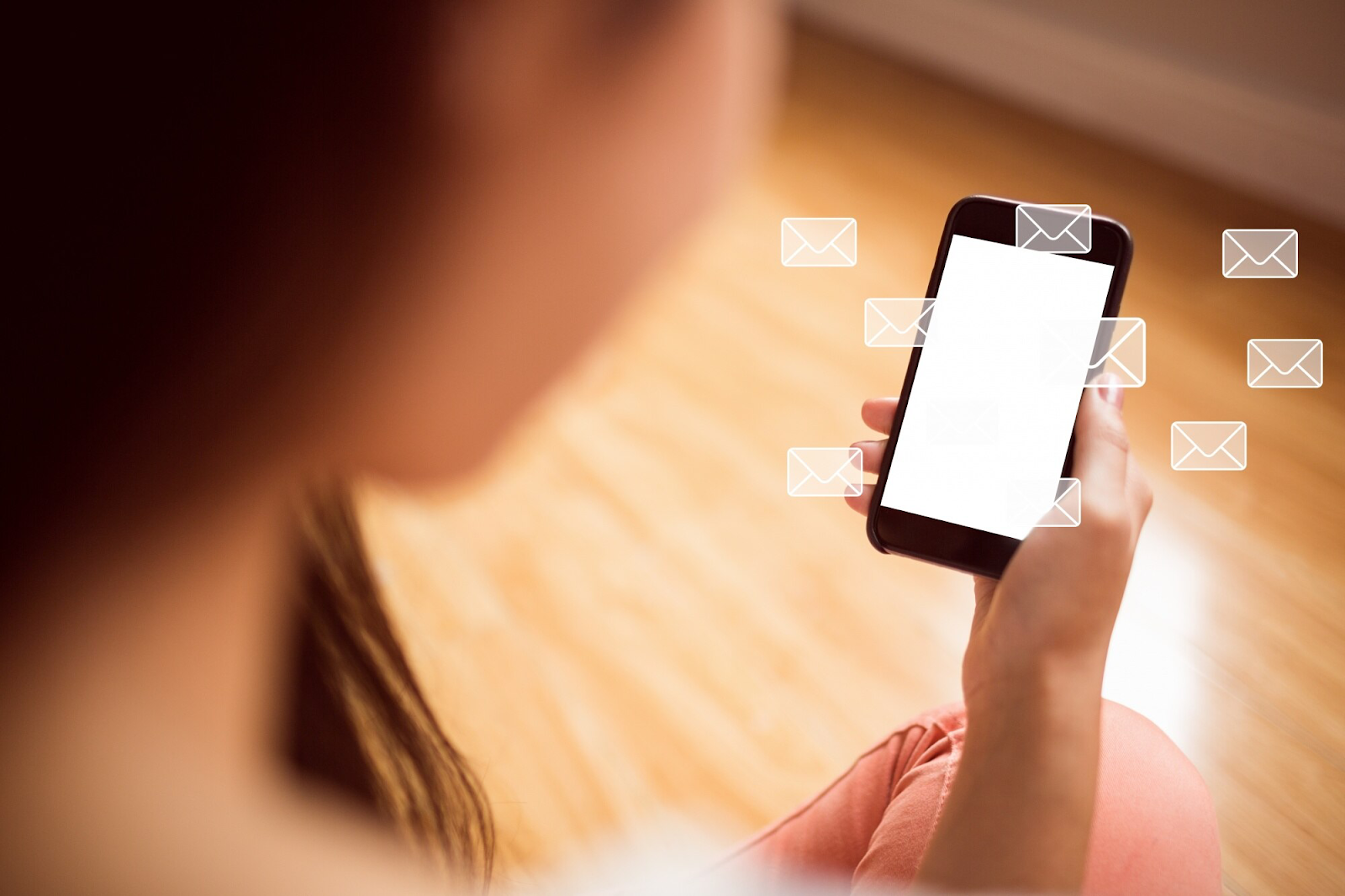 A person holding a smartphone and checking incoming messages