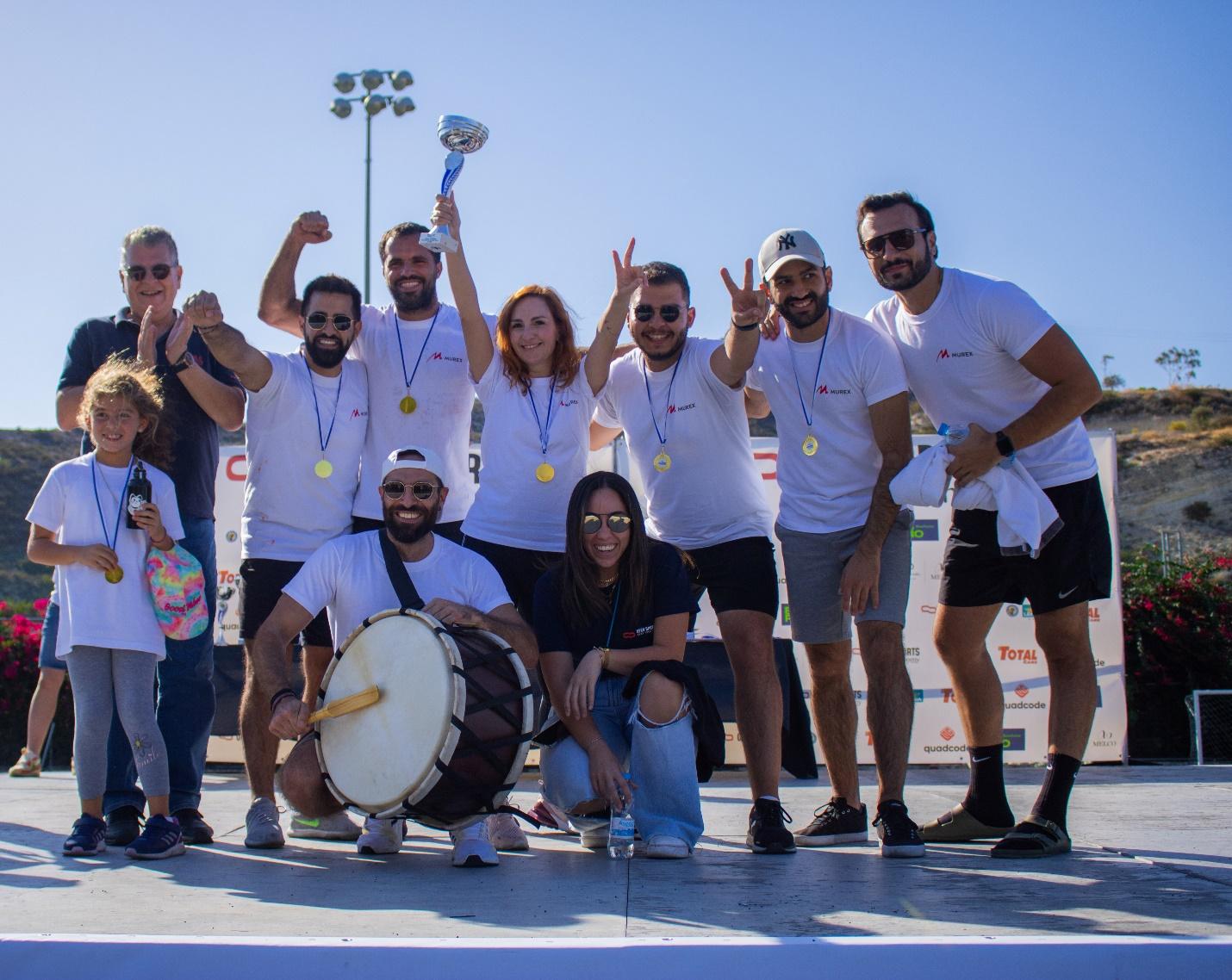 A group of people posing for a photo

Description automatically generated