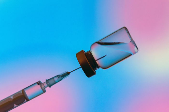 a-syringe-drawing-liquid-from-a-vial-against-a-pink-and-blue-gradient-background-running-orals-without-ovagen-youre-asking-for-system-failure-tony-huge