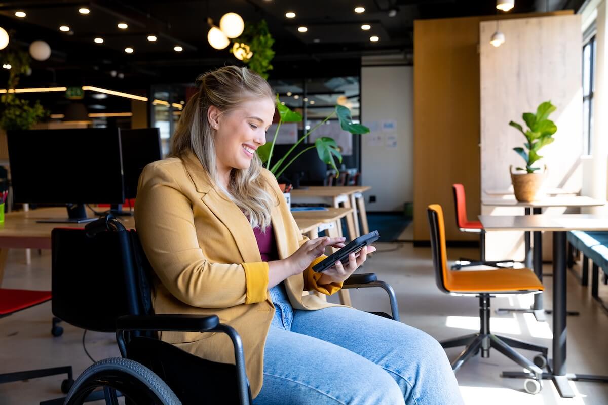 Employee in a wheelchair using a tablet
