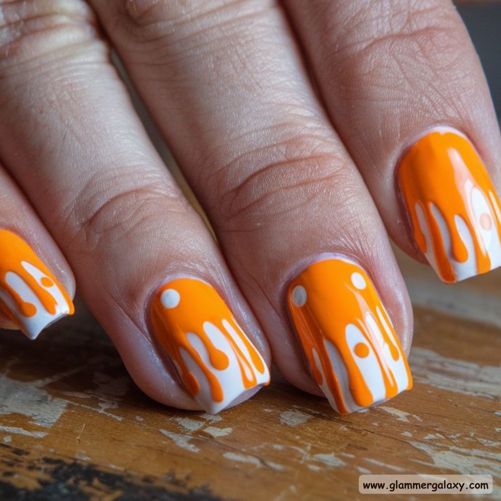 Birthday Nail Designs having Orange Drip Nail Art
