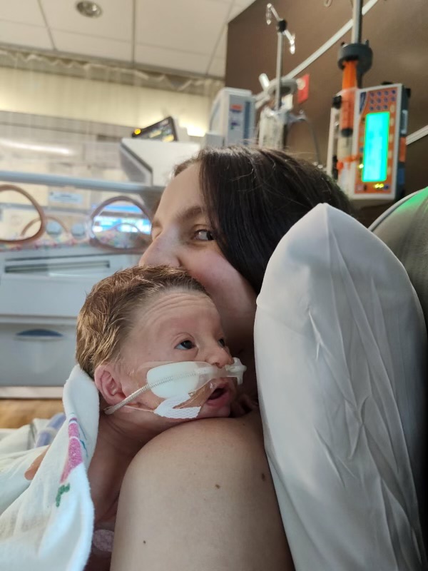 Mom and baby practice skin to skin in the NICU.