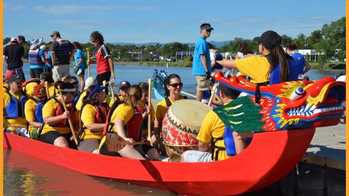 A team on the dragon boat getting ready for a race.