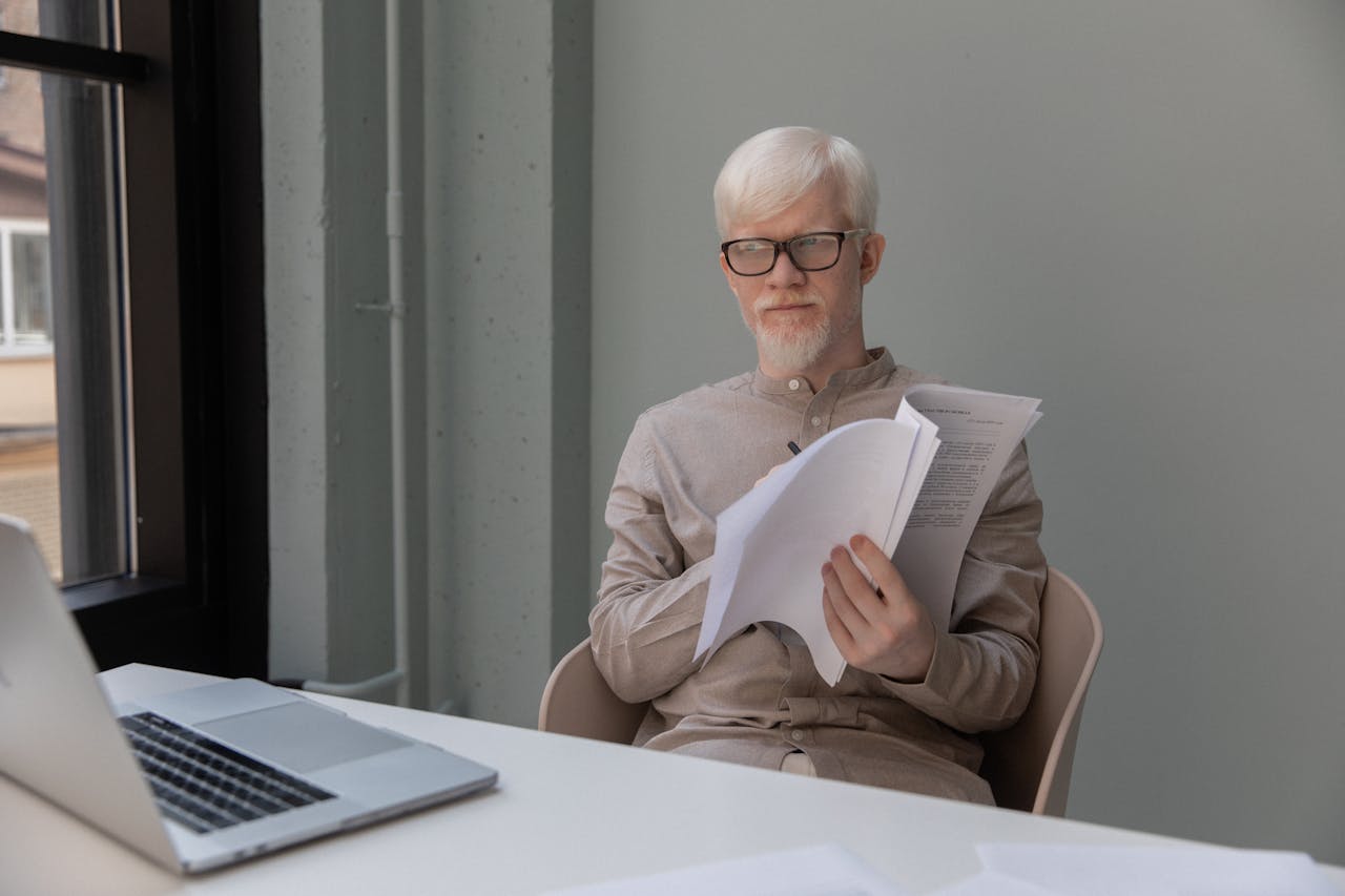 A man revising his written work