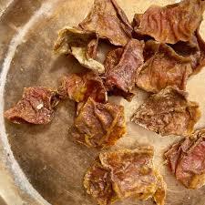 A pile of dried meat on a plate

Description automatically generated