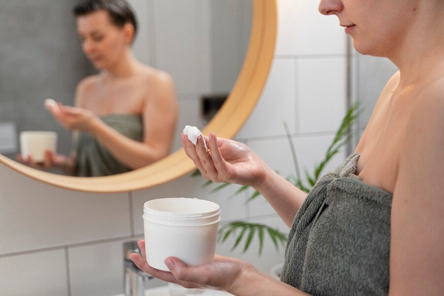 Woman applying anti-dandruff product