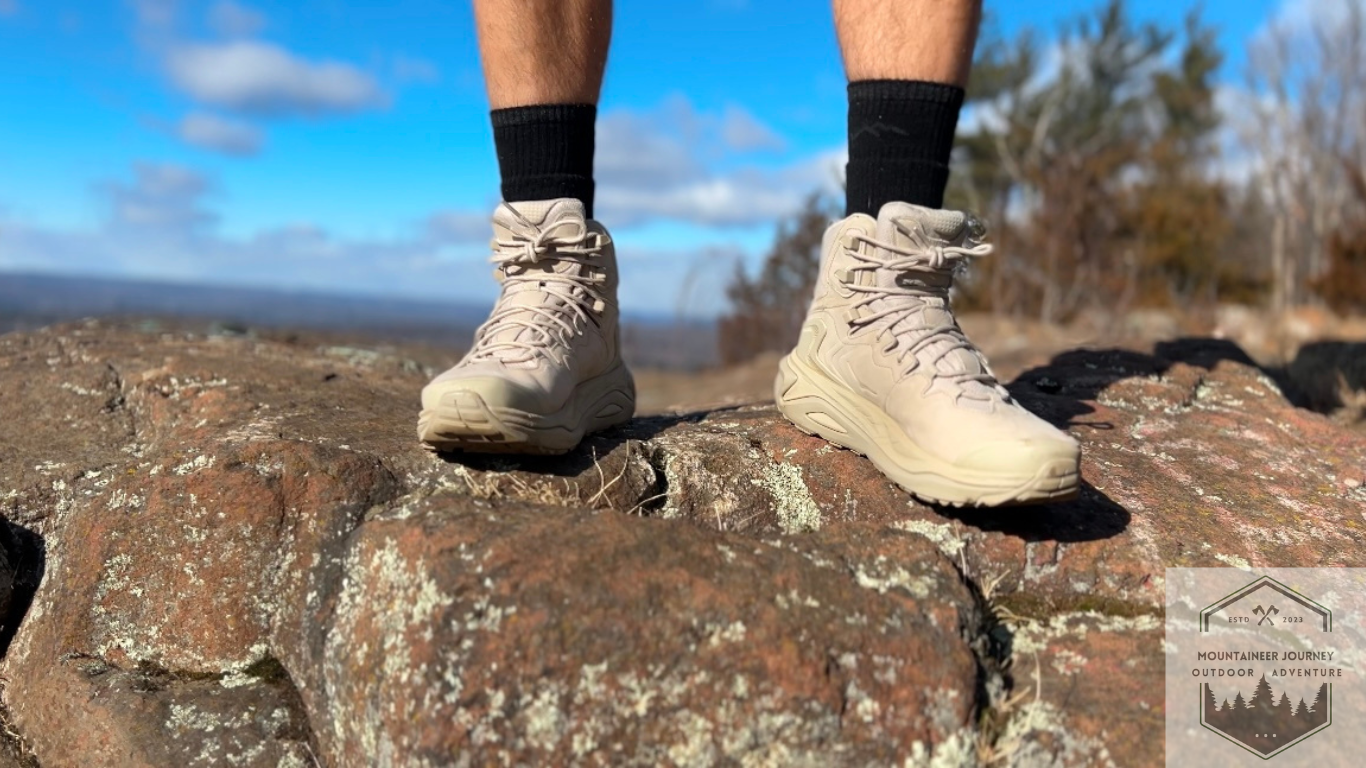 Hoka Kaha 3 at top of rock highlighting the thick outsoles