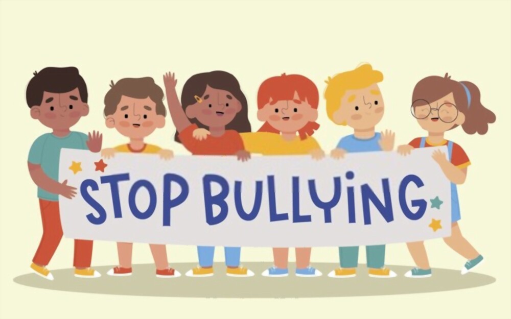 Kids holding a banner asking to stop bullying