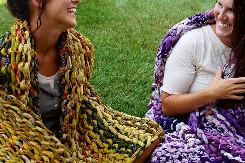 Two Freedom Fighters laughing wrapped in blankets