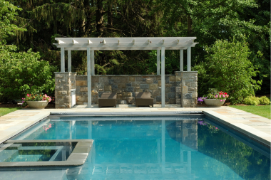 michigan hardscaping ideas for every season vinyl pergola with stone base near backyard pool custom built okemos