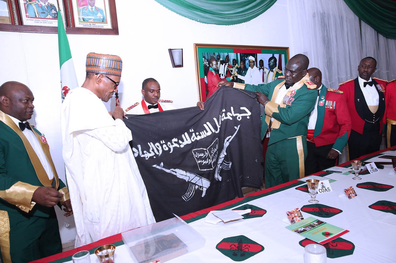 Misleading! Image not showing Buhari waving Boko Haram flag