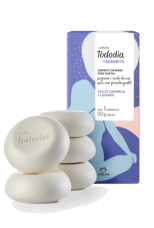 A stack of white soaps

Description automatically generated