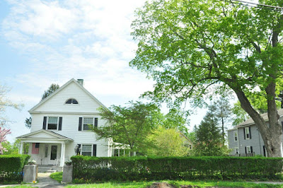 House near green trees during the daytime, New England.