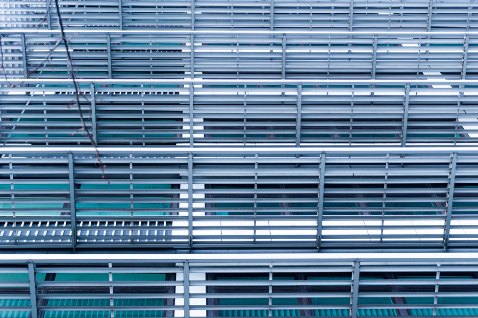 An image showcasing numerous horizontal commercial louvers on the side of a building.