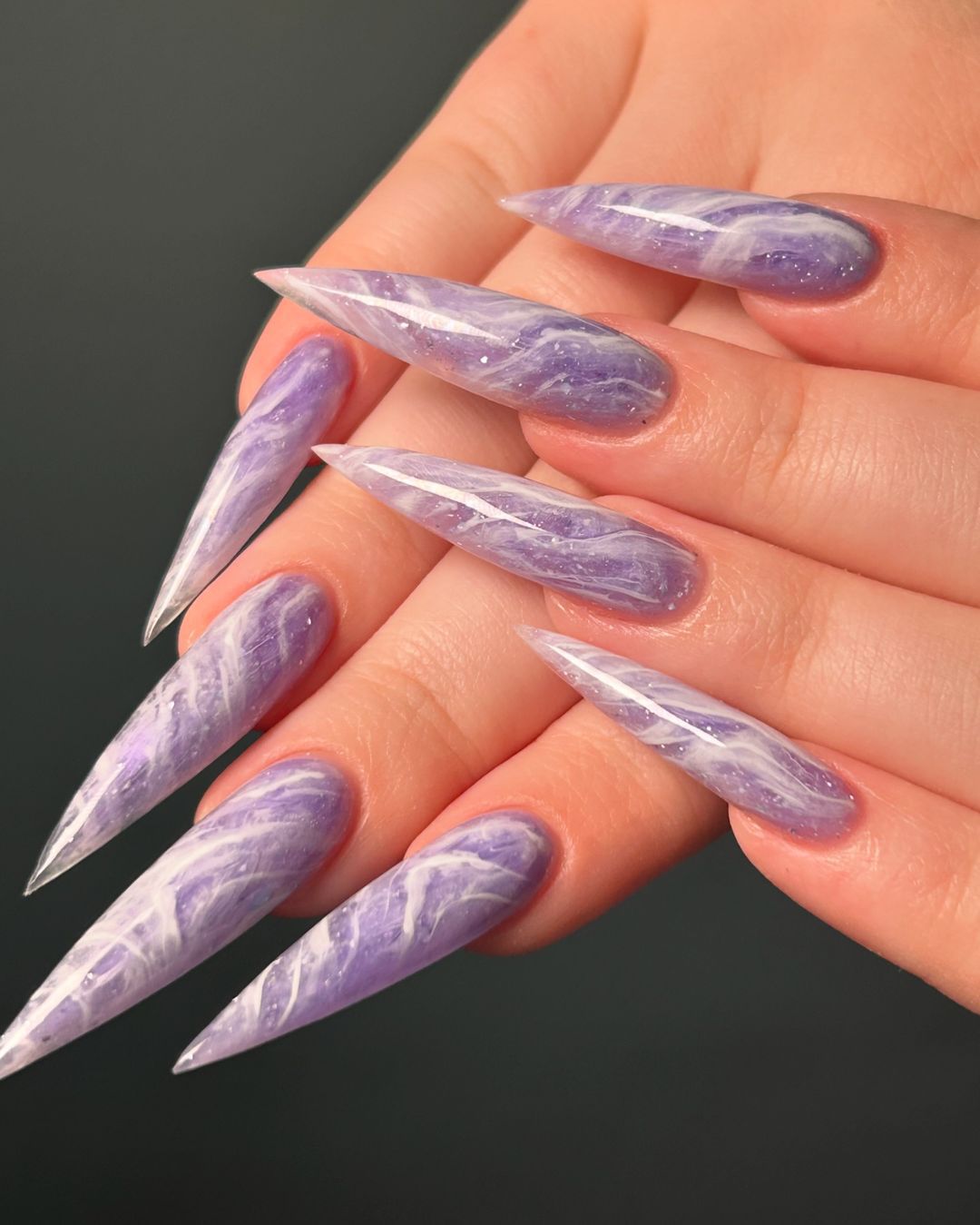 Close-up of hands with Watercolor Lavender Nails