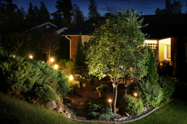 landscaping mistakes to avoid while remodeling your outdoor living space backyard lighting with trees and foliage custom built michigan