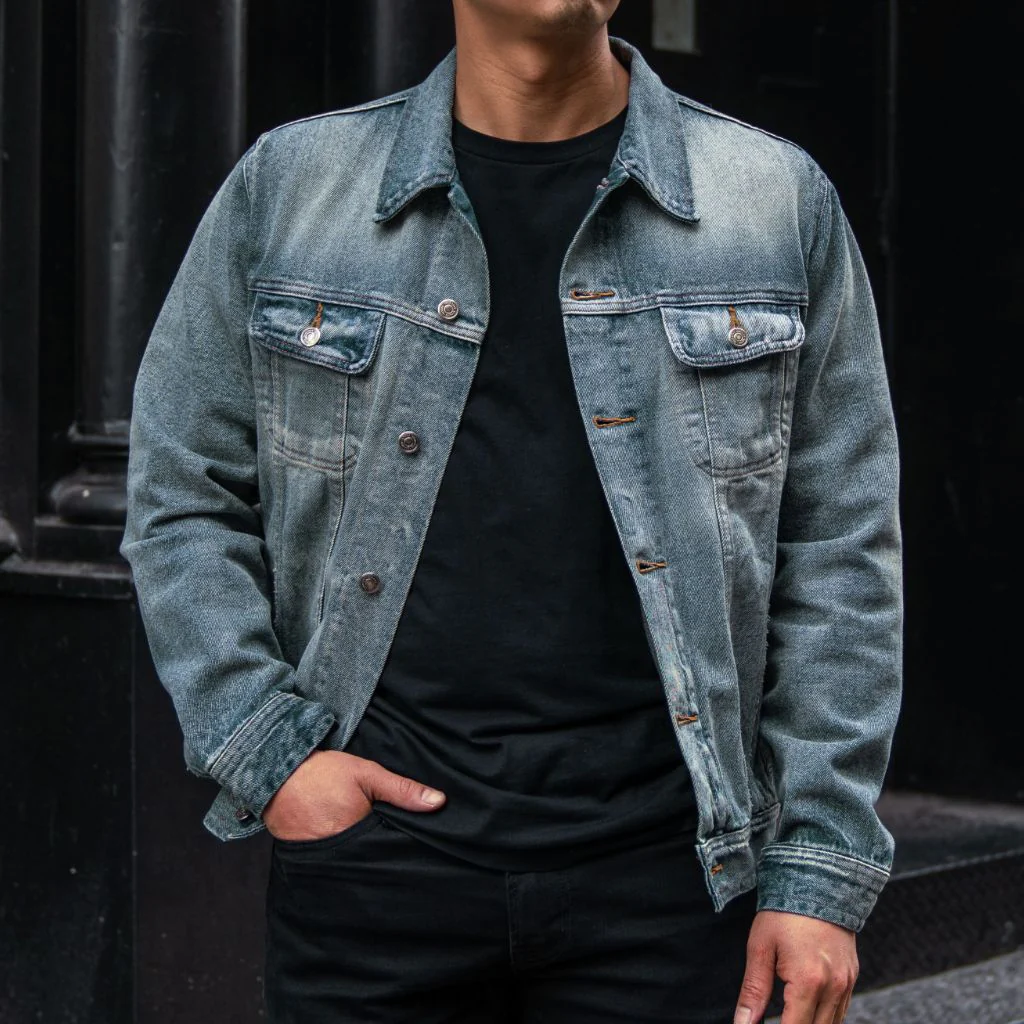 The Denim Jacket especially designed for men with buttoned closure and two front pockets at the top.