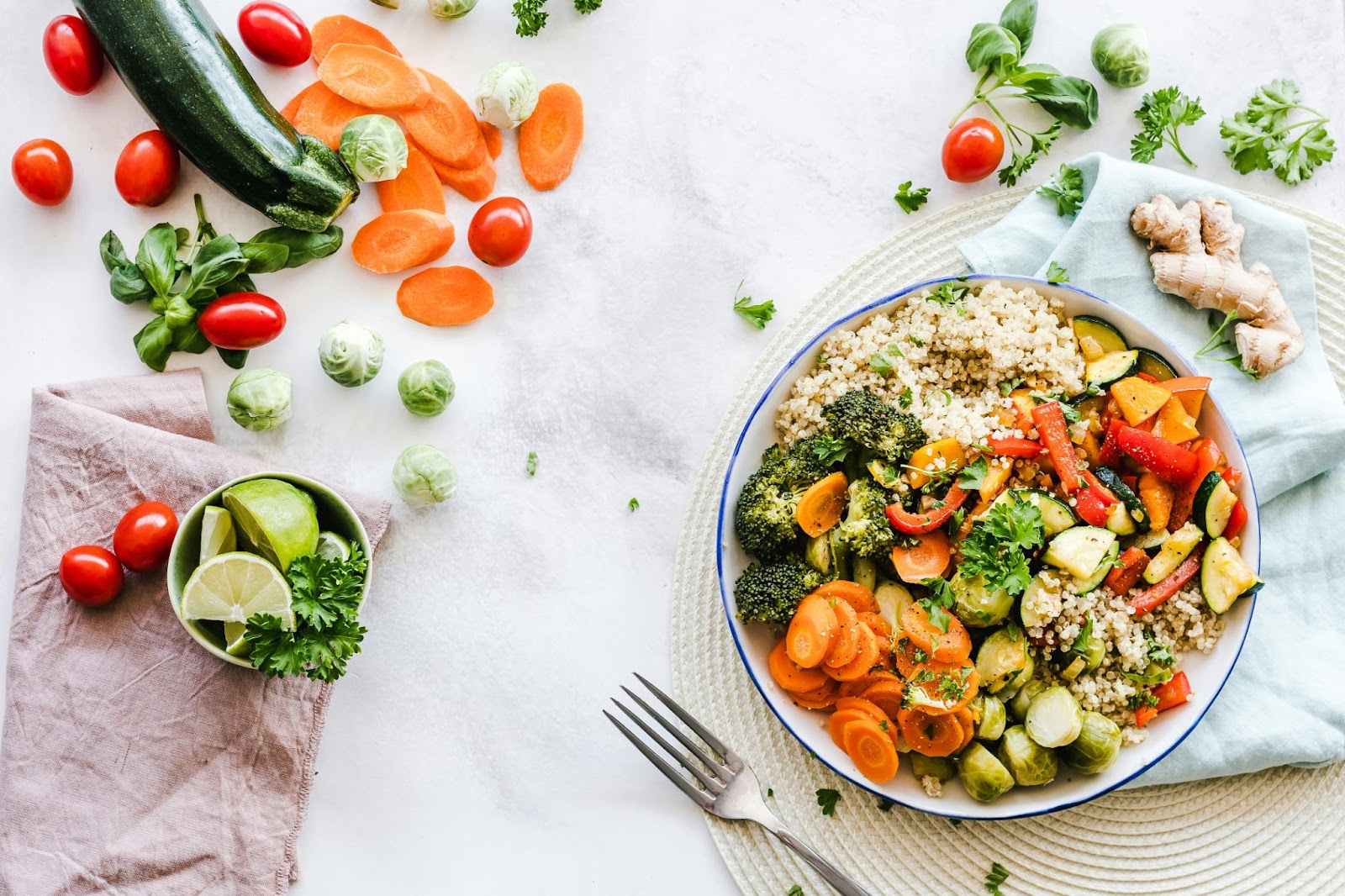 A picture of whole grains, vegetables, and fruit on a table