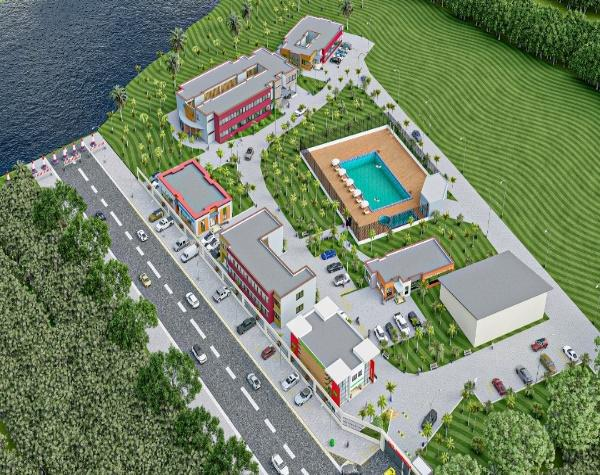 Aerial view of a town with a pool and a road

Description automatically generated