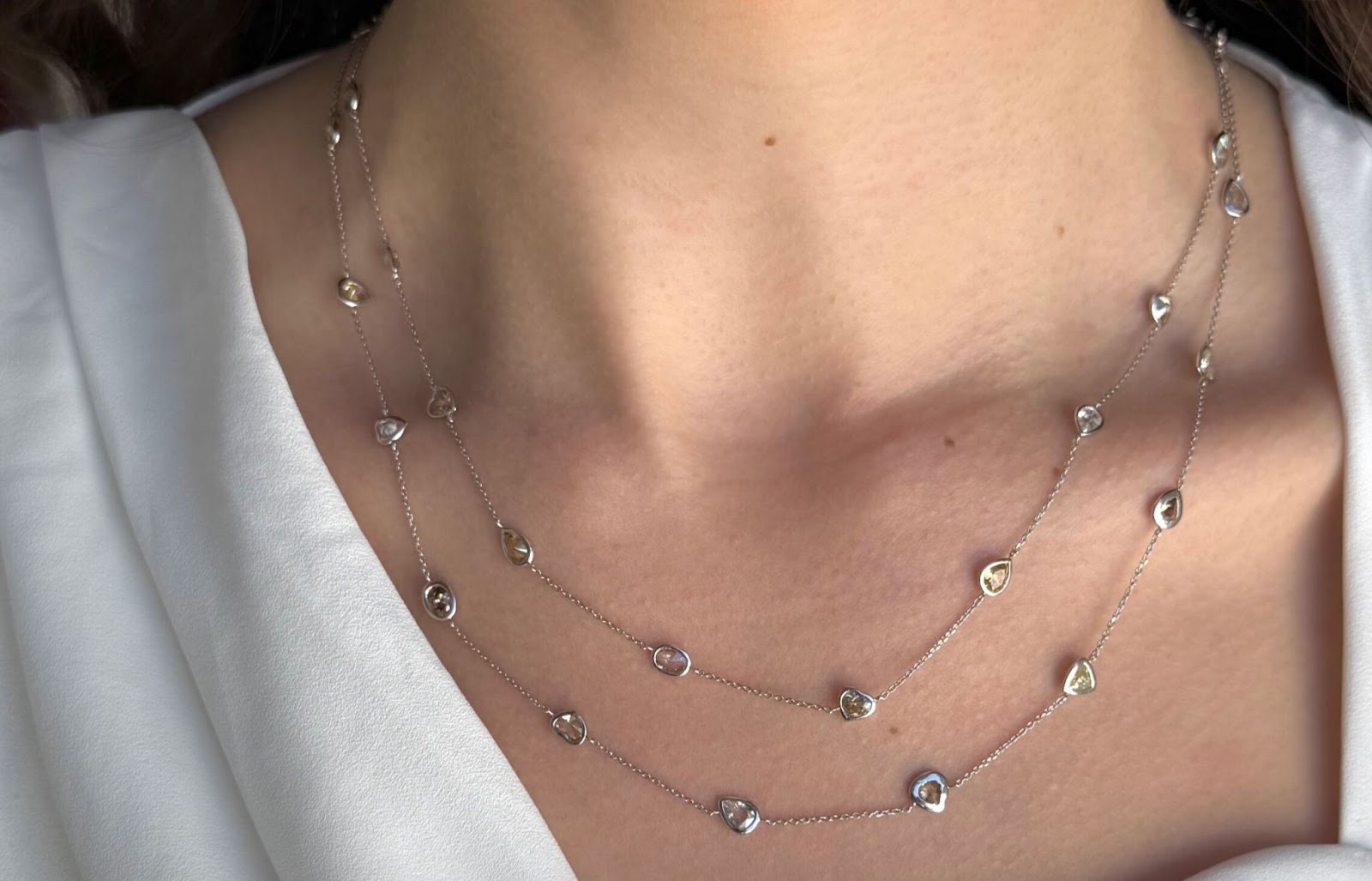 Multi-color diamond necklace layered, the perfect accessory for cocktail attire.