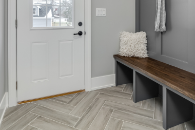 how to upgrade your mudroom for michigan winters storage and flooring ideas herringbone luxury vinyl plank flooring custom built okemos