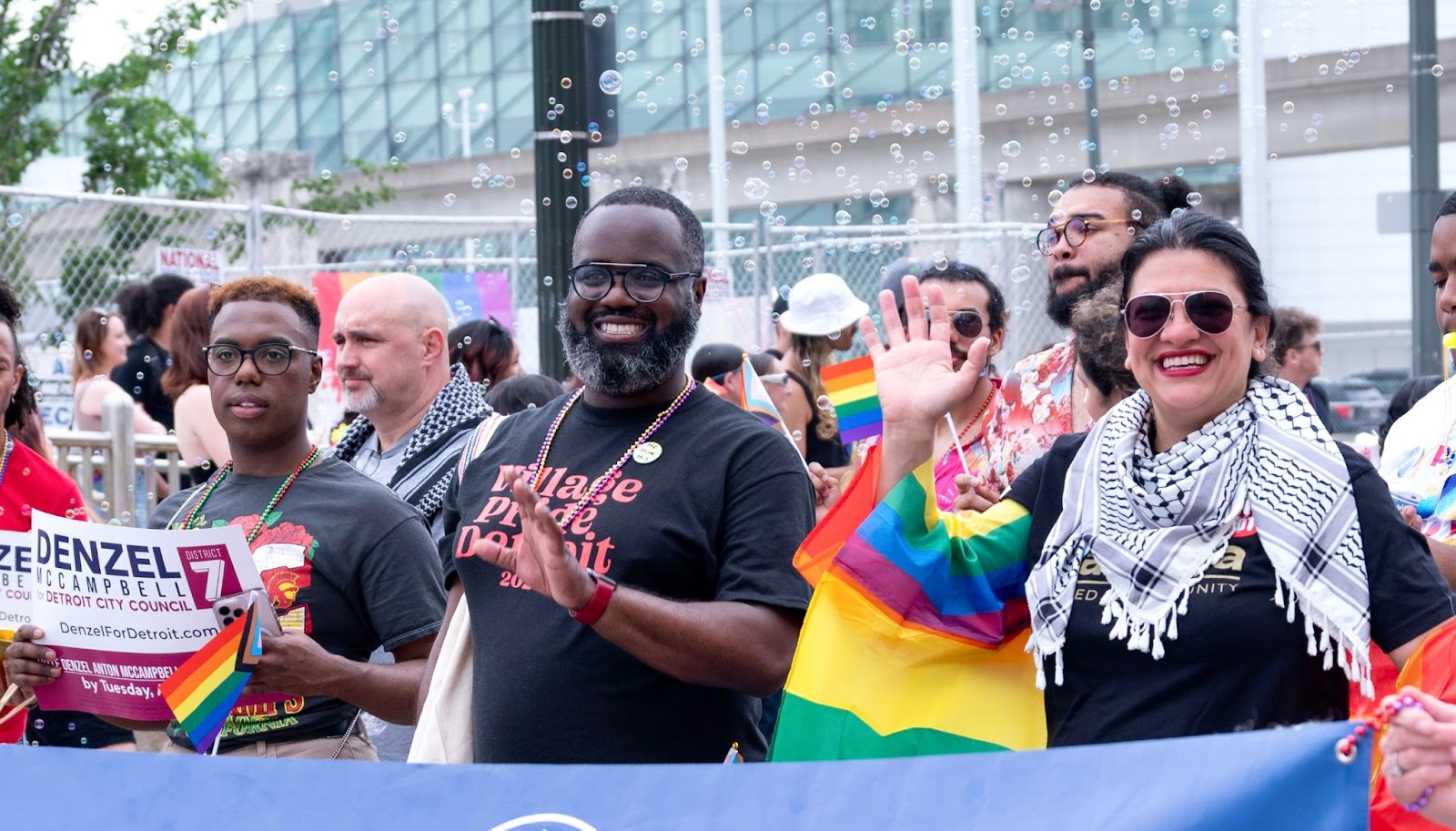Rashida and Denz march in the Pride Parade