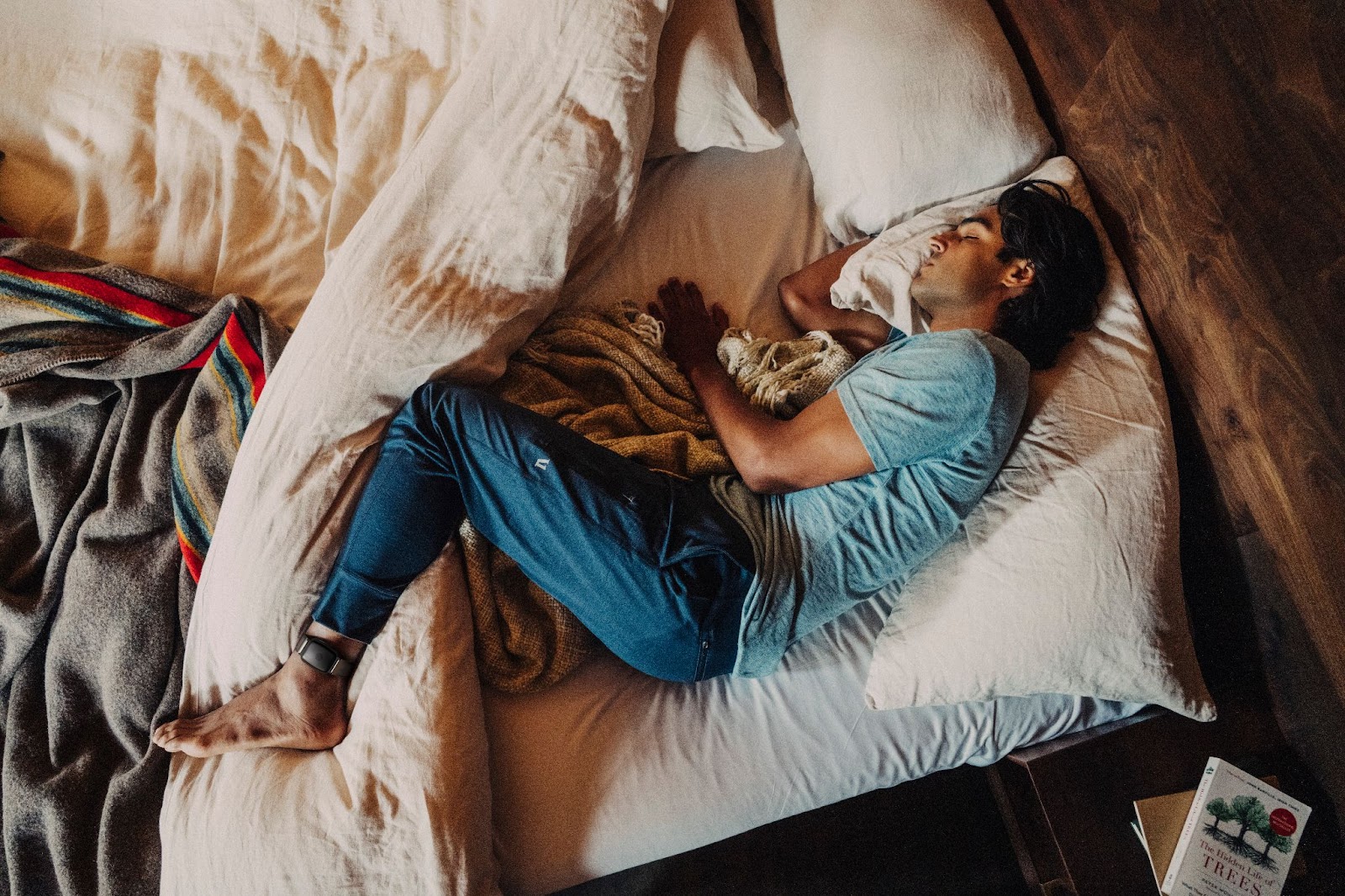 Man wearing Apollo 2.0 on ankle enjoying deep sleep