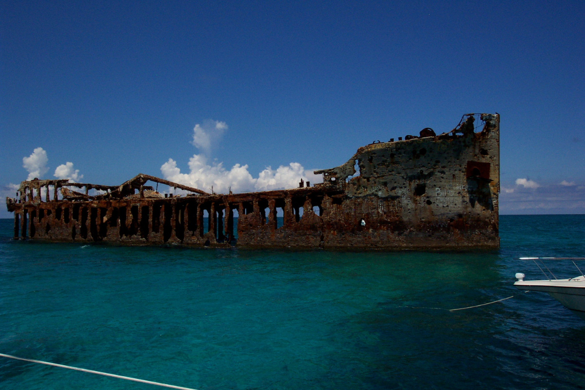 Old rusted ship in the clean and clear water 