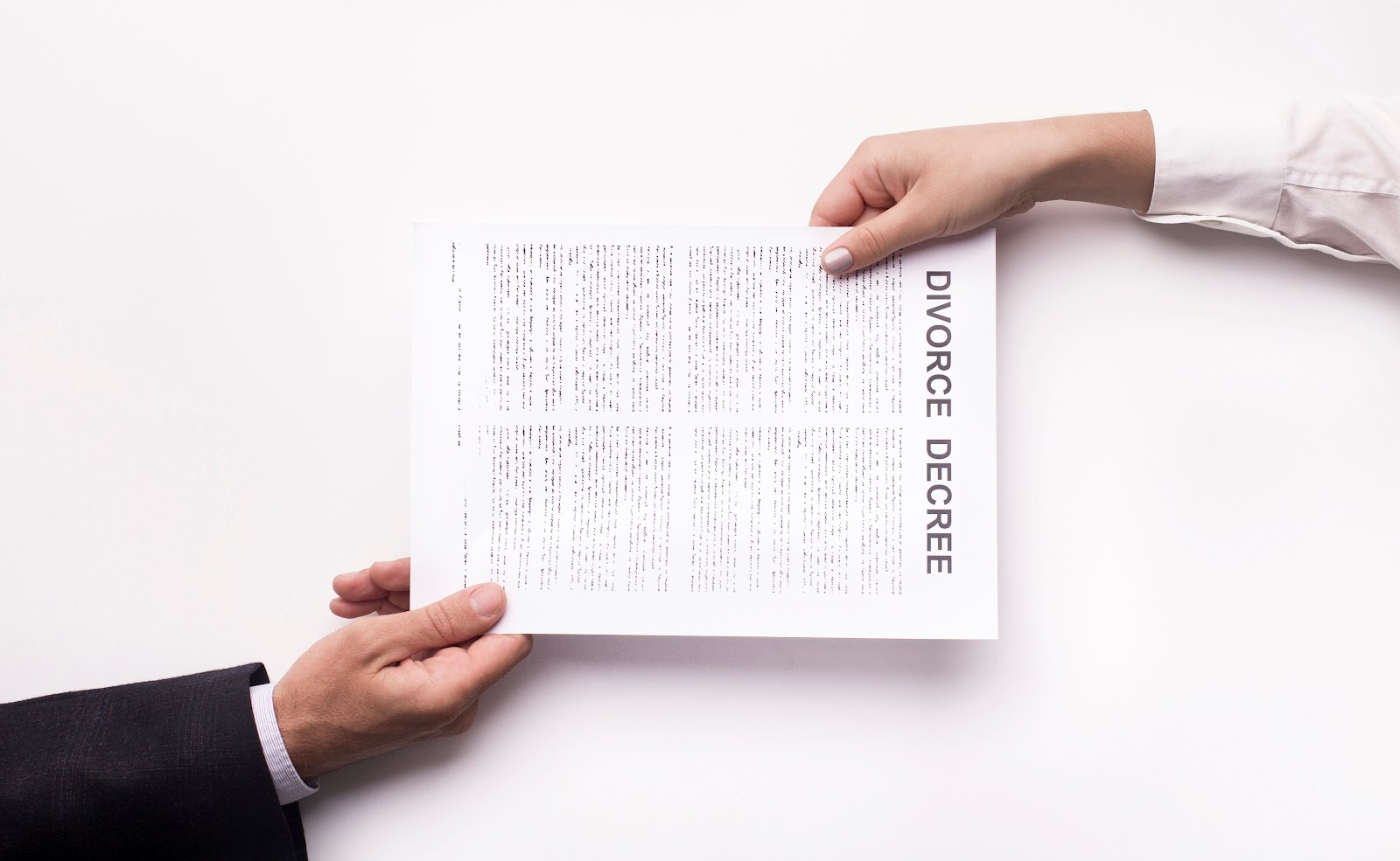 Husband and wife holding a divorce contract | Source: Shutterstock