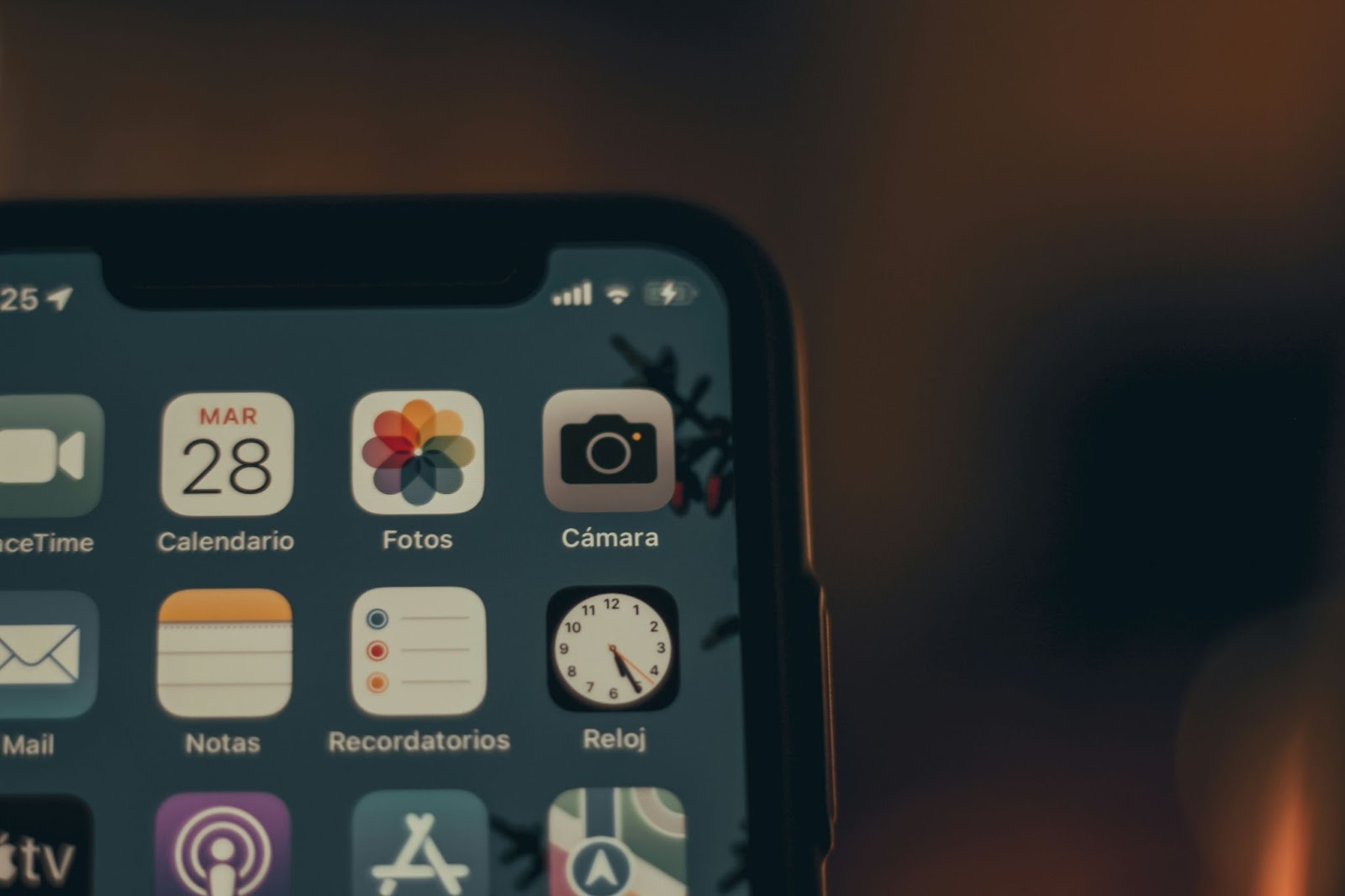 A phone screen showing multiple app logos, with one app featuring a photo icon