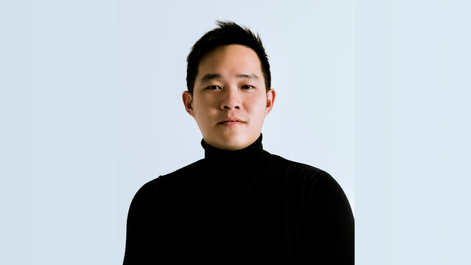 Chester Yow, a Licensed Associate Real Estate Broker and Founder of the Chester Yow Team at SERHANT, smiling confidently in professional attire.