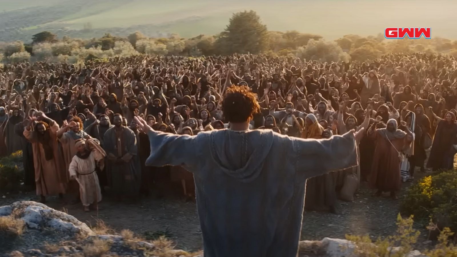 LaKeith Stanfield addressing a large crowd in "The Book of Clarence"