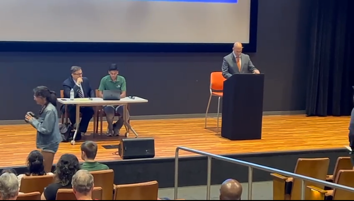 Amir Omar at the Podium in UT Dallas Student Service Auditorium for the Richardson Mayoral Debate